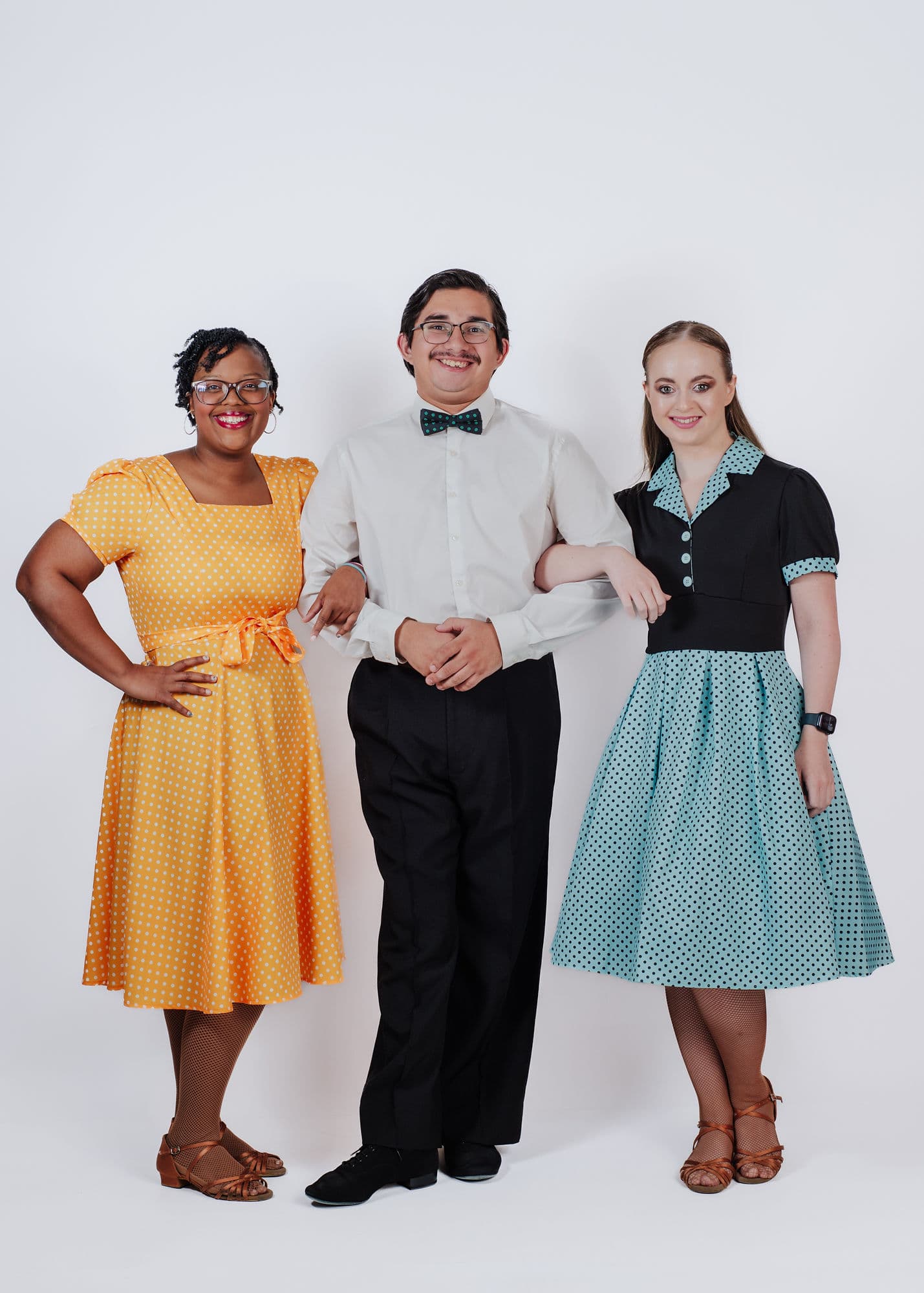 Three Dynasty Stars dancers in colorful vintage-style outfits